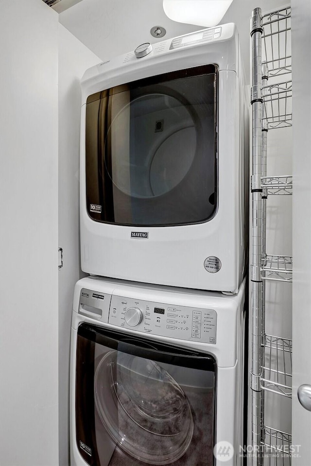 2000 1st Ave Unit 703, Seattle, WA 98121 - washroom with stacked washer and clothes dryer