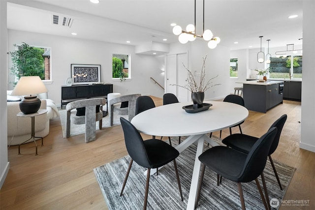 3424 20th Ave S, Seattle, WA 98144 - dining room with plenty of natural light, recessed lighting, light wood-type flooring, and a chandelier