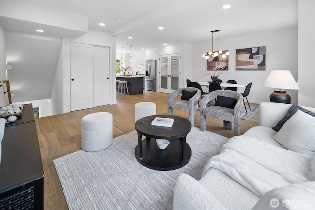 3424 20th Ave S, Seattle, WA 98144 - living area featuring light wood-style flooring, a chandelier, and recessed lighting