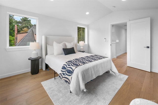 3424 20th Ave S, Seattle, WA 98144 - bedroom featuring vaulted ceiling, multiple windows, wood finished floors, and recessed lighting