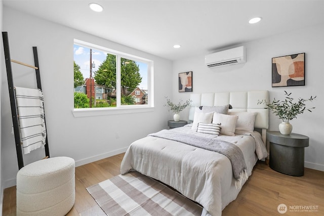 3424 20th Ave S, Seattle, WA 98144 - bedroom with a wall unit AC, wood finished floors, and recessed lighting