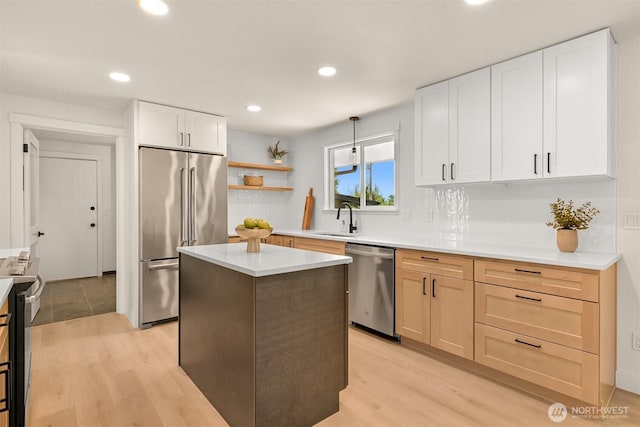 16740 Dunbar Rd, Mount Vernon, WA 98273 - kitchen featuring stainless steel appliances, recessed lighting, a center island, light countertops, and light wood-style flooring