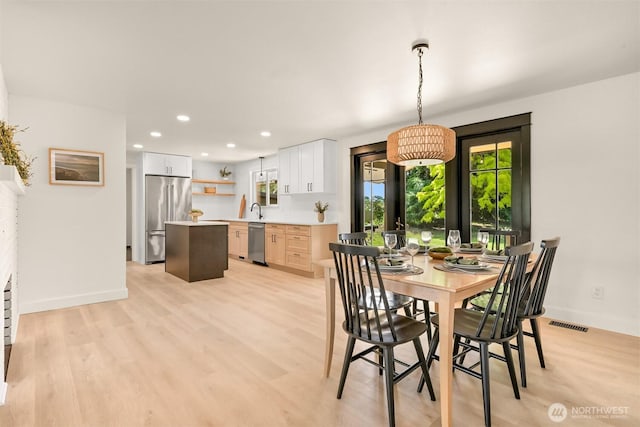 16740 Dunbar Rd, Mount Vernon, WA 98273 - dining room featuring light wood finished floors and recessed lighting