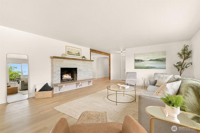 16740 Dunbar Rd, Mount Vernon, WA 98273 - living room with wood finished floors, arched walkways, and a fireplace