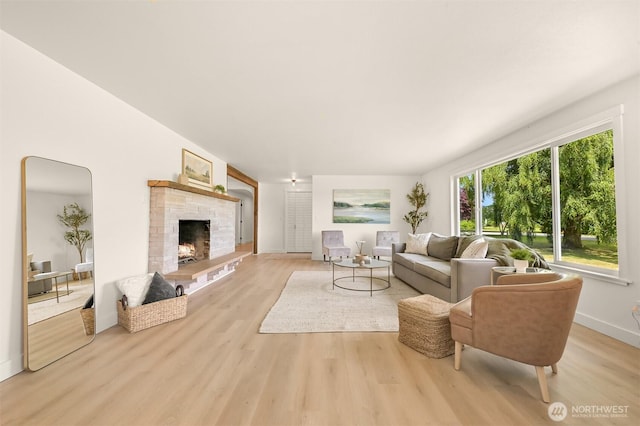 16740 Dunbar Rd, Mount Vernon, WA 98273 - living area featuring wood finished floors and a stone fireplace
