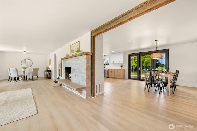16740 Dunbar Rd, Mount Vernon, WA 98273 - living room with light wood-type flooring and a fireplace with raised hearth