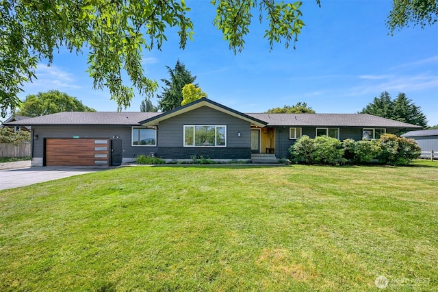 16740 Dunbar Rd, Mount Vernon, WA 98273 - single story home with concrete driveway, an attached garage, and a front yard