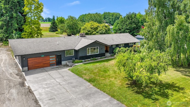 16740 Dunbar Rd, Mount Vernon, WA 98273 - view of front facade with driveway, a garage, a front yard, and a shingled roof