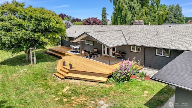 16740 Dunbar Rd, Mount Vernon, WA 98273 - rear view of property featuring a lawn, a wooden deck, roof with shingles, and a chimney