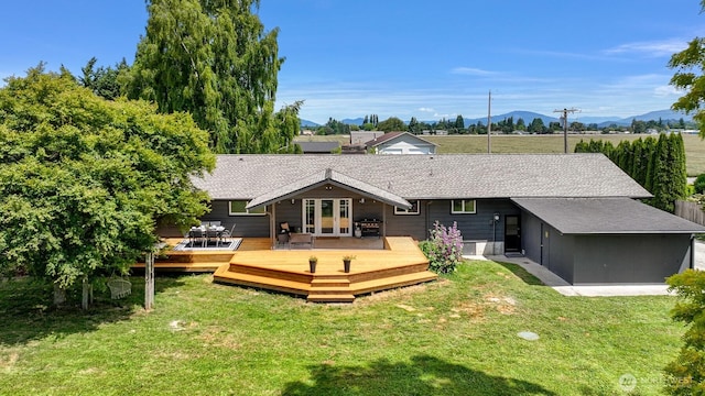 16740 Dunbar Rd, Mount Vernon, WA 98273 - rear view of property featuring a yard, a deck with mountain view, and roof with shingles