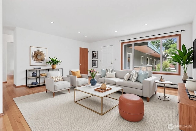 1919 2nd Ave W, Seattle, WA 98119 - living room featuring wood finished floors, baseboard heating, and recessed lighting