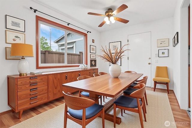 1919 2nd Ave W, Seattle, WA 98119 - dining space with light wood-style floors and a ceiling fan