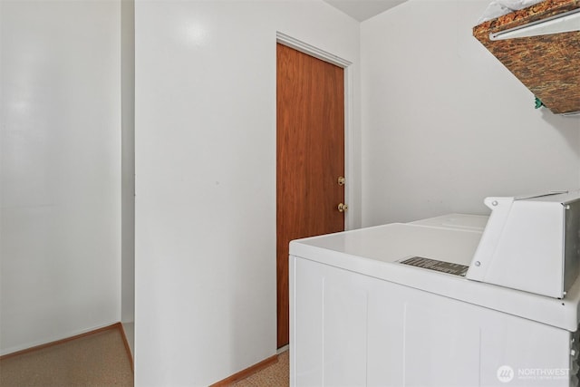 1919 2nd Ave W, Seattle, WA 98119 - laundry area featuring independent washer and dryer and baseboards