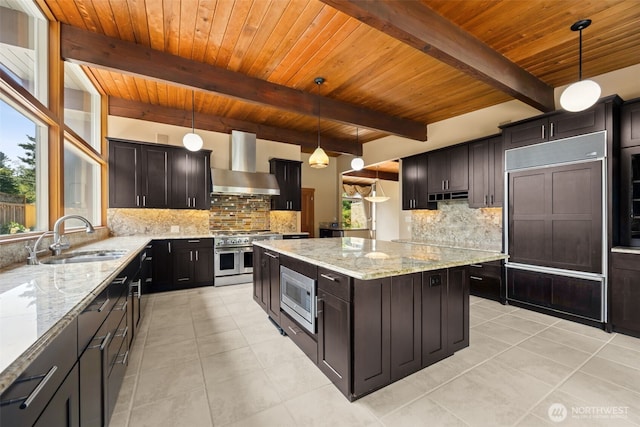 126 SW 171st St, Normandy Park, WA 98166 - kitchen featuring wall chimney range hood, built in appliances, light tile patterned flooring, a wooden ceiling with exposed beams, and backsplash
