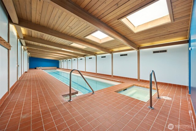 126 SW 171st St, Normandy Park, WA 98166 - indoor pool featuring a skylight and an in-ground hot tub
