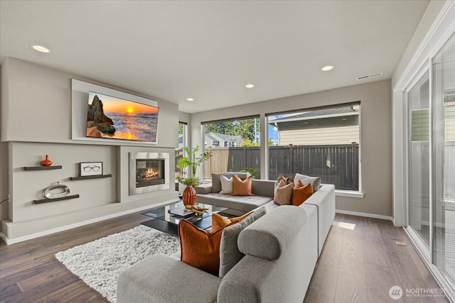 35404 55th Ave S, Auburn, WA 98001 - living area featuring a glass covered fireplace, wood finished floors, and recessed lighting