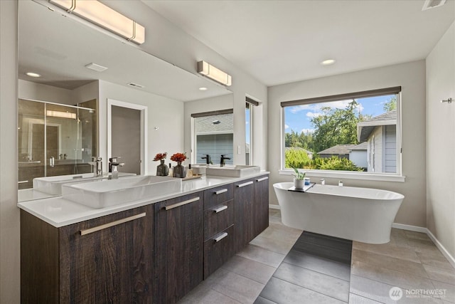 35404 55th Ave S, Auburn, WA 98001 - full bath featuring a stall shower, double vanity, a freestanding tub, recessed lighting, and tile patterned flooring