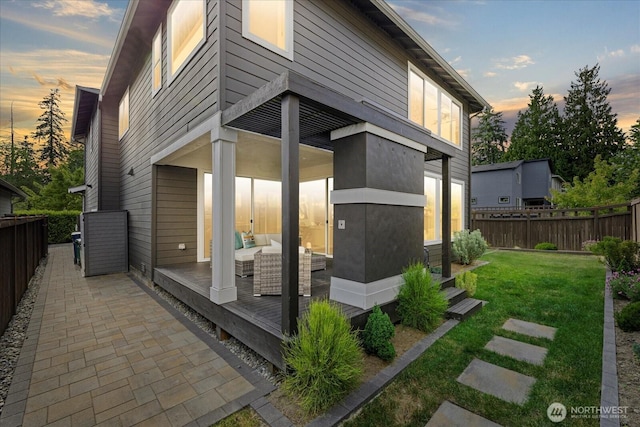35404 55th Ave S, Auburn, WA 98001 - back of house at dusk featuring a wooden deck