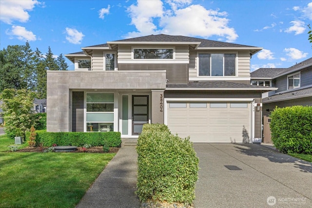 35404 55th Ave S, Auburn, WA 98001 - view of front of home with an attached garage, concrete driveway, and a front lawn