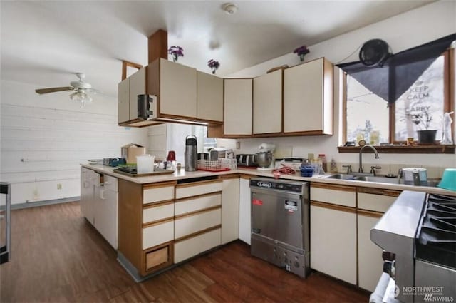 715 Locust St, Omak, WA 98841 - kitchen with stainless steel dishwasher, dark wood-type flooring, a ceiling fan, light countertops, and gas range