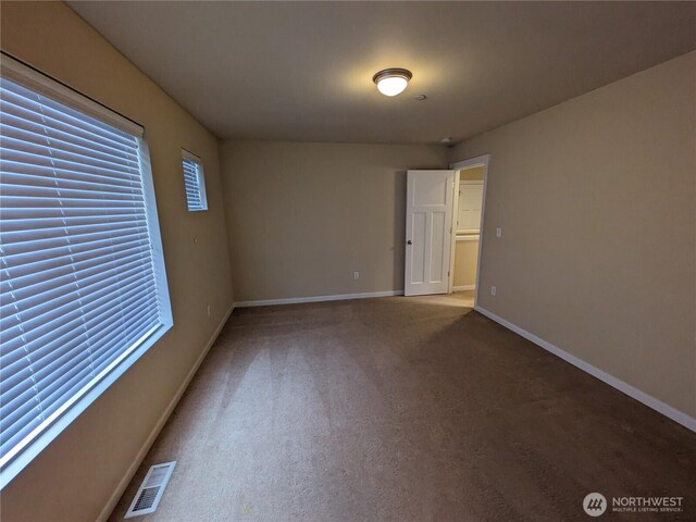 1077 Hiton Cir, Dupont, WA 98327 - unfurnished room featuring carpet flooring and healthy amount of natural light