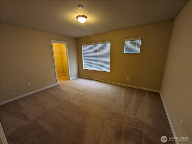 1077 Hiton Cir, Dupont, WA 98327 - carpeted spare room featuring baseboards