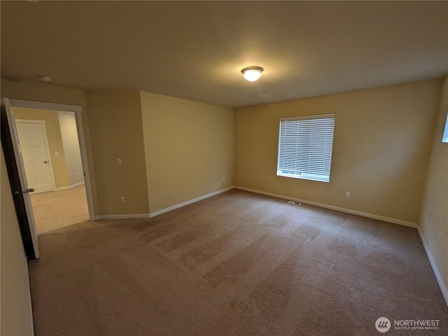 1077 Hiton Cir, Dupont, WA 98327 - carpeted spare room featuring baseboards