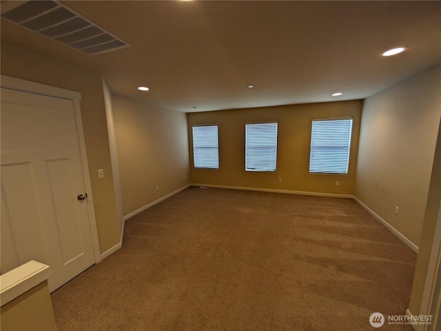 1077 Hiton Cir, Dupont, WA 98327 - carpeted spare room featuring recessed lighting and plenty of natural light