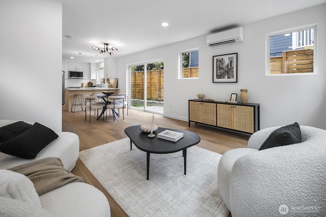 3422 20th Ave S, Seattle, WA 98144 - living area featuring a wall mounted air conditioner, light wood finished floors, and recessed lighting