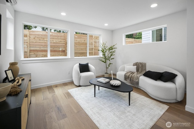 3422 20th Ave S, Seattle, WA 98144 - living area featuring wood finished floors, recessed lighting, and a wall unit AC