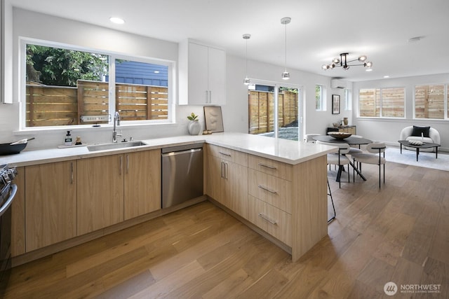 3422 20th Ave S, Seattle, WA 98144 - kitchen featuring appliances with stainless steel finishes, light wood finished floors, light brown cabinetry, light countertops, and recessed lighting