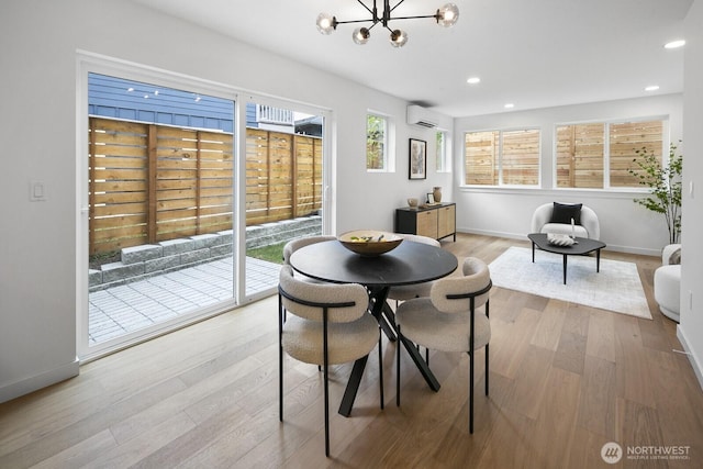 3422 20th Ave S, Seattle, WA 98144 - dining area with a wall mounted AC, a chandelier, recessed lighting, and wood finished floors
