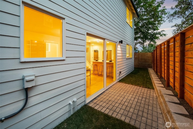 3422 20th Ave S, Seattle, WA 98144 - patio terrace at dusk with a fenced backyard