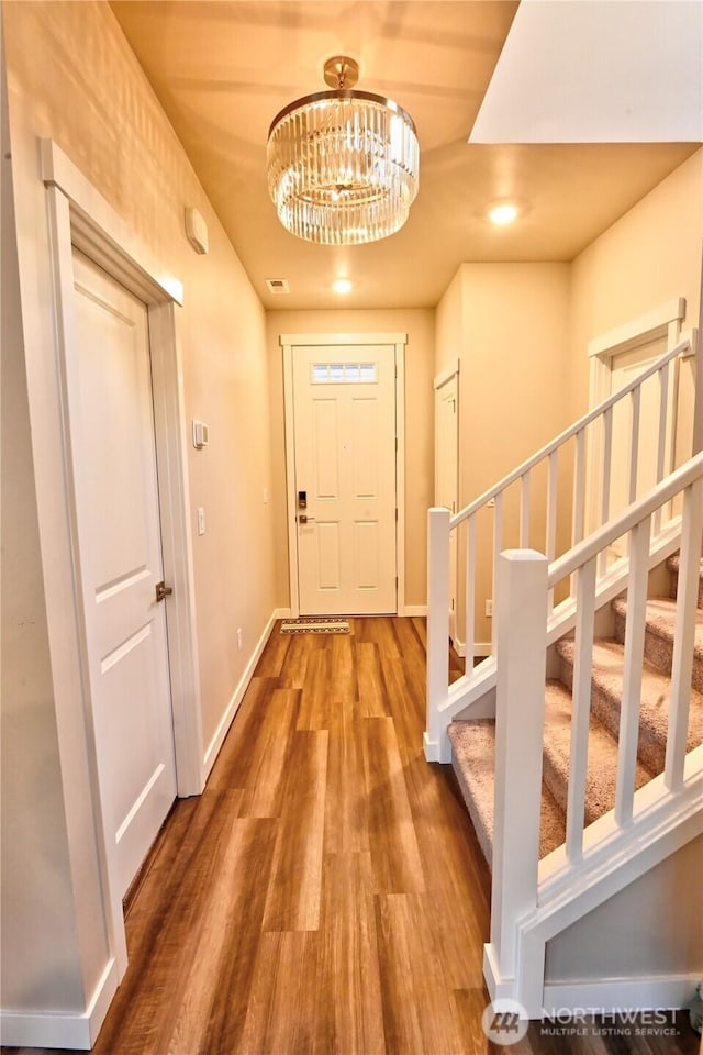 14363 271st Cir NE, Duvall, WA 98019 - entrance foyer featuring stairs, wood finished floors, a chandelier, and recessed lighting