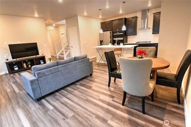 14363 271st Cir NE, Duvall, WA 98019 - living room with stairs, light wood-style flooring, and recessed lighting