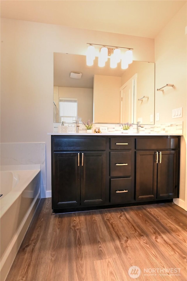14363 271st Cir NE, Duvall, WA 98019 - full bath featuring double vanity, a bath, and wood finished floors