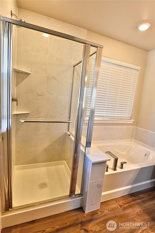 14363 271st Cir NE, Duvall, WA 98019 - full bathroom featuring a garden tub, a shower stall, and wood finished floors