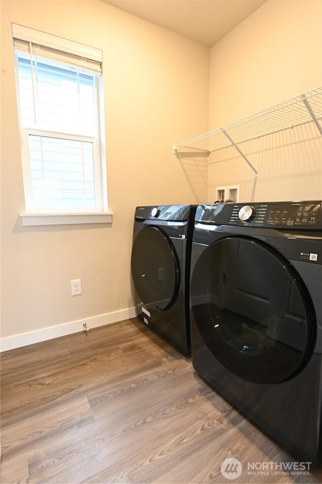 14363 271st Cir NE, Duvall, WA 98019 - washroom with independent washer and dryer and wood finished floors
