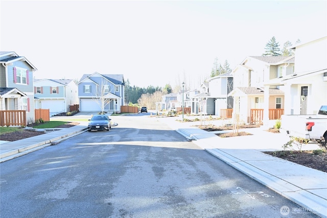 14363 271st Cir NE, Duvall, WA 98019 - view of asphalt street featuring a residential view, curbs, sidewalks, and street lighting