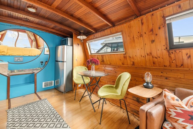2550-2738 Westlake Ave N Unit 01-117, Seattle, WA 98109 - sitting room with a wood ceiling with exposed beams, wood finished floors, and wood walls