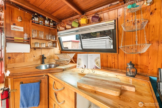 2550-2738 Westlake Ave N Unit 01-117, Seattle, WA 98109 - kitchen with a wood ceiling with exposed beams, wood walls, and wooden counters
