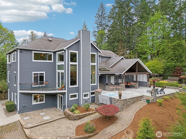 16908 SE Licorice Way, Newcastle, WA 98059 - back of property featuring a patio area, a chimney, and outdoor lounge area