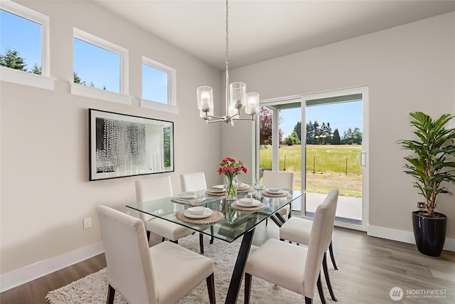 2122 Hawks View Ln, Winlock, WA 98596 - dining space featuring a chandelier and dark wood finished floors
