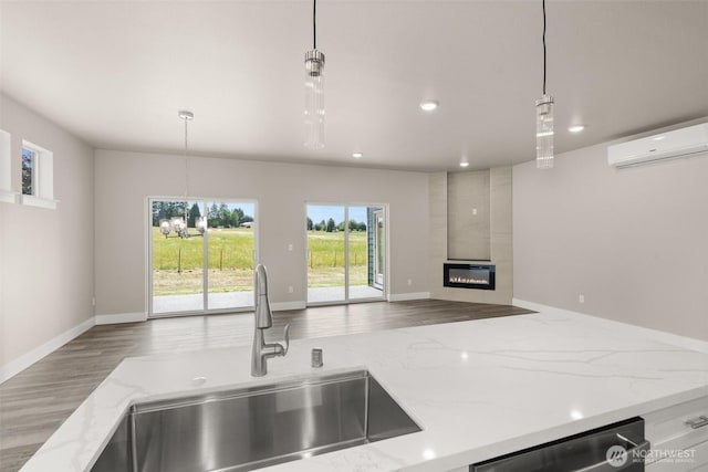 2122 Hawks View Ln, Winlock, WA 98596 - kitchen featuring a wall unit AC, open floor plan, a large fireplace, dishwasher, and recessed lighting