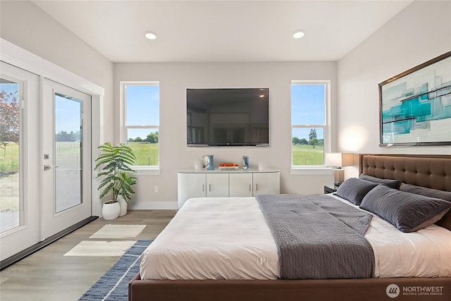 2122 Hawks View Ln, Winlock, WA 98596 - bedroom with access to exterior, light wood-style floors, and recessed lighting