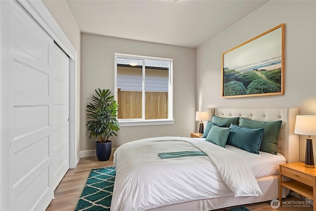 2122 Hawks View Ln, Winlock, WA 98596 - bedroom with light wood-style floors and baseboards