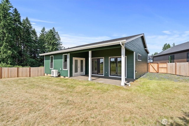 2122 Hawks View Ln, Winlock, WA 98596 - rear view of house featuring a fenced backyard, a patio, and french doors
