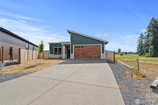 2122 Hawks View Ln, Winlock, WA 98596 - mid-century inspired home featuring stone siding, board and batten siding, a garage, and concrete driveway