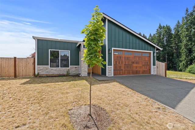 2122 Hawks View Ln, Winlock, WA 98596 - mid-century modern home featuring board and batten siding, stone siding, and driveway