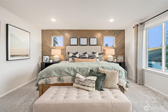 8705 126th Street Ct E, Puyallup, WA 98374 - carpeted bedroom with wood walls, multiple windows, recessed lighting, and an accent wall